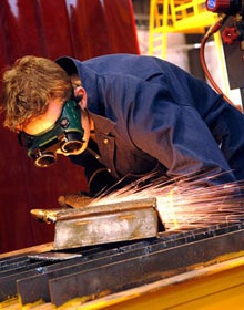 A student practicing welding at Victoria University