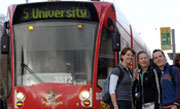 Life in melbourne- 3 international students with a tram showing how easy it is to use melbourne's public transport Life in melbourne- 3 international students with a tram showing how easy it is to use melbourne's public transport