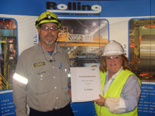 Paul Cotter and Jan Burton dressed in High Vis and Hard hats
