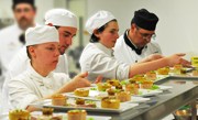 trainee chefs preparing dessert trainee chefs preparing dessert