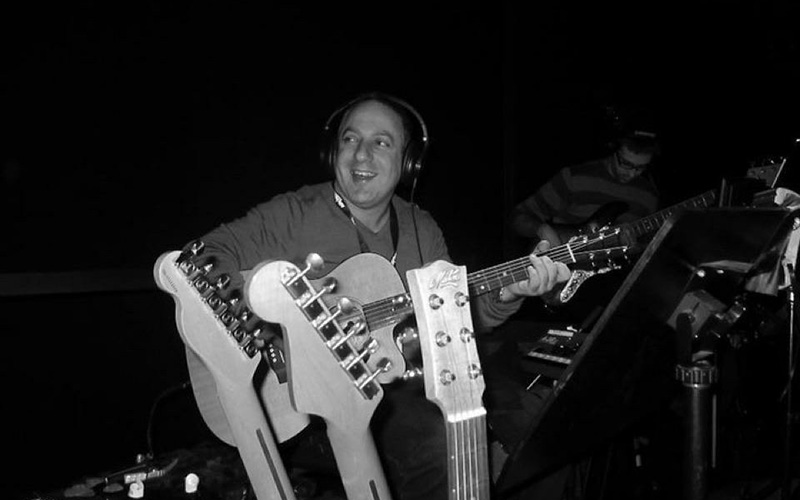  Stephen Rando Staff Profile Photo Playing Guitar