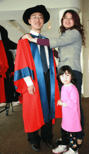 Yanan Hao receives PhD accompanied by wife Lina and daughter Lily