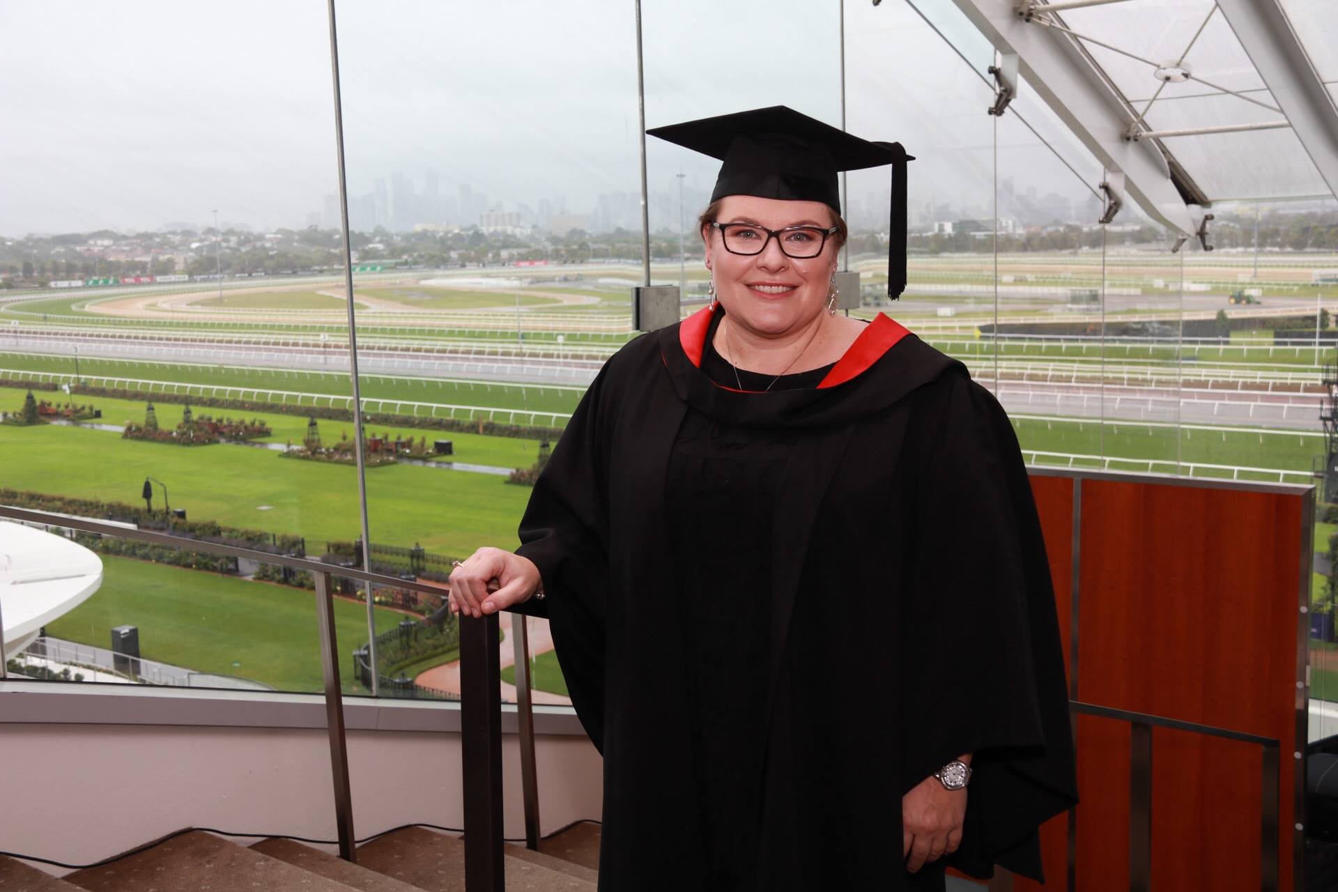 Bachelor of Education graduate posing before the ceremony at Flemington Racecourse