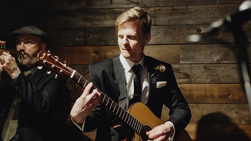  chris-b-profile-shot-performing-guitar-on-stage