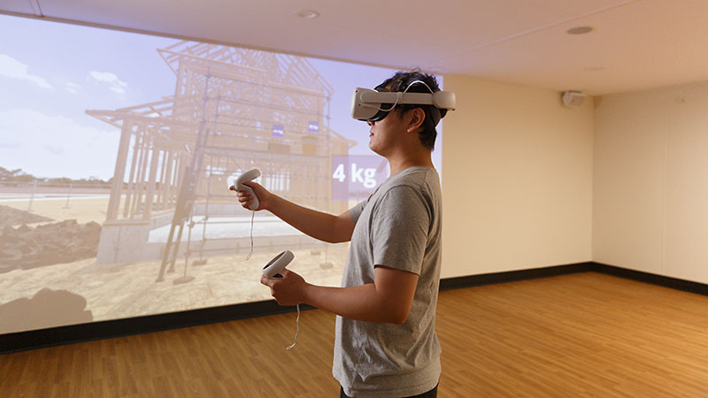 A student using virtual reality tools within the Construction Simulation (COSI) Lab.