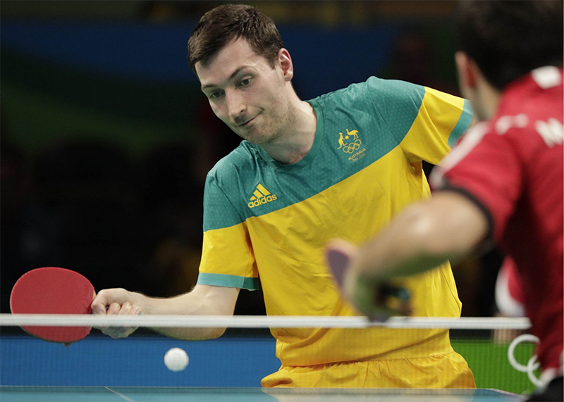 David Powell competing in a table tennis match.