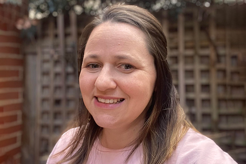 Joanna Little, smiling, outdoors