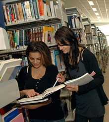 Students looking at a book