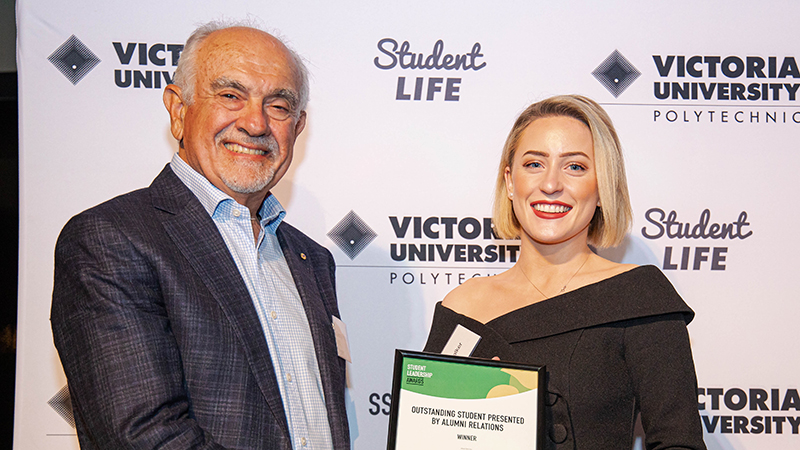 Female student with Chancellor receiving award