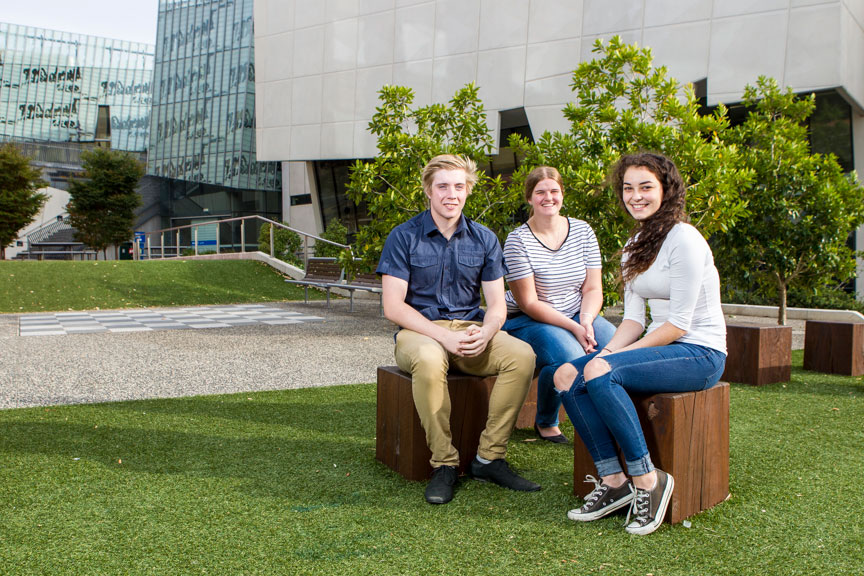 three students on campus