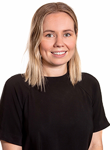 Hannah Matthews, young female policy fellow, smiles at camera
