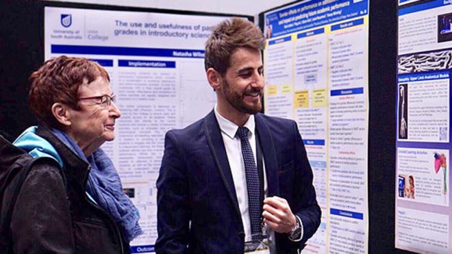Ghaith Zakaria with the award-winning poster