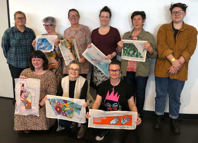 Some of the ThreadIN participants with their needlepoint artworks.