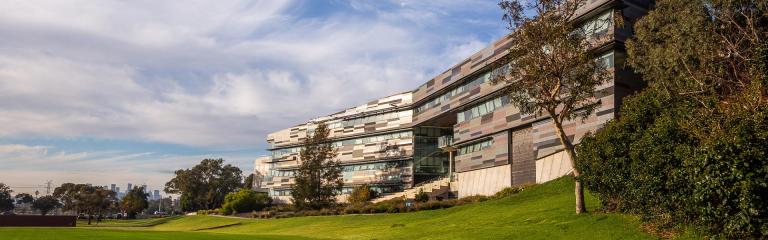 Footscray Park Campus modern building, from a green sport field