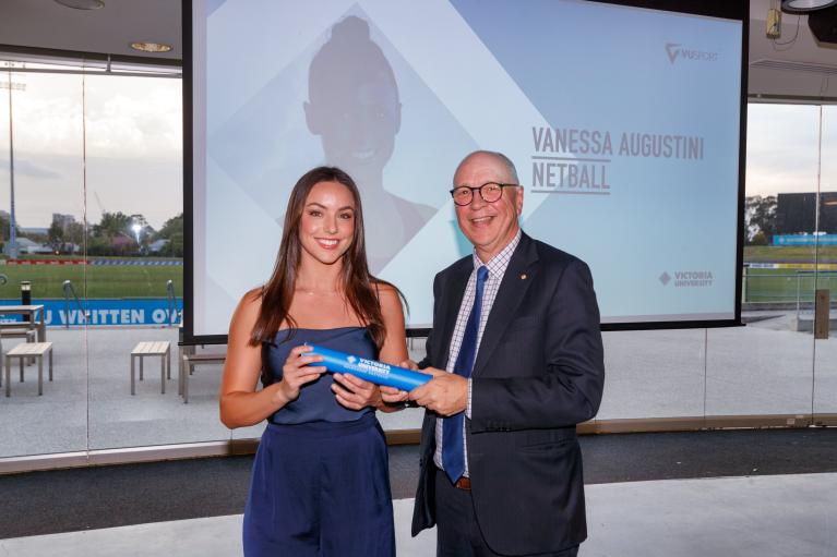 VU Student Vanessa Augustini receiving award from VC