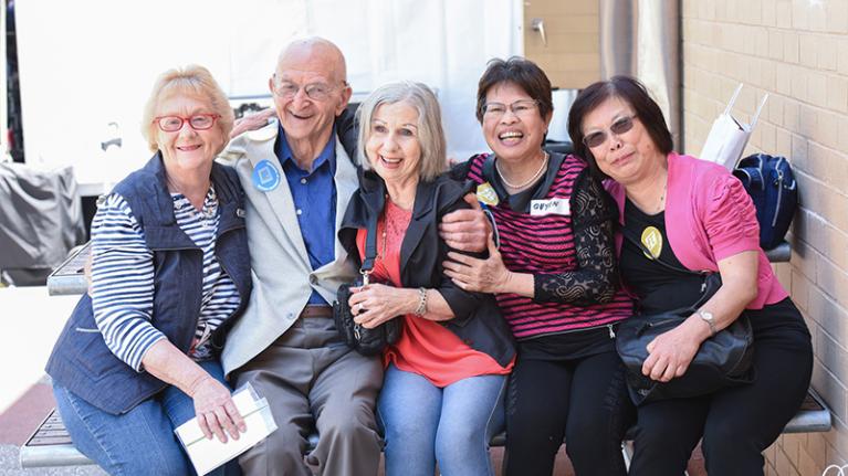 VU alumni laugh during a reunion on campus.