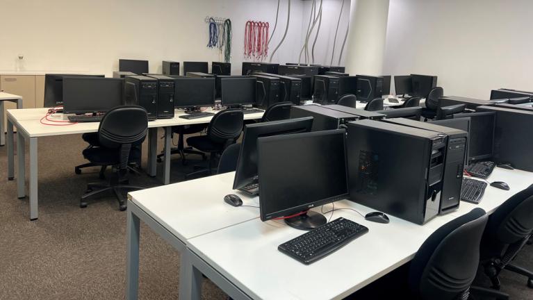  A photo of multiple computers in VU's dedicated Cisco networking lab.