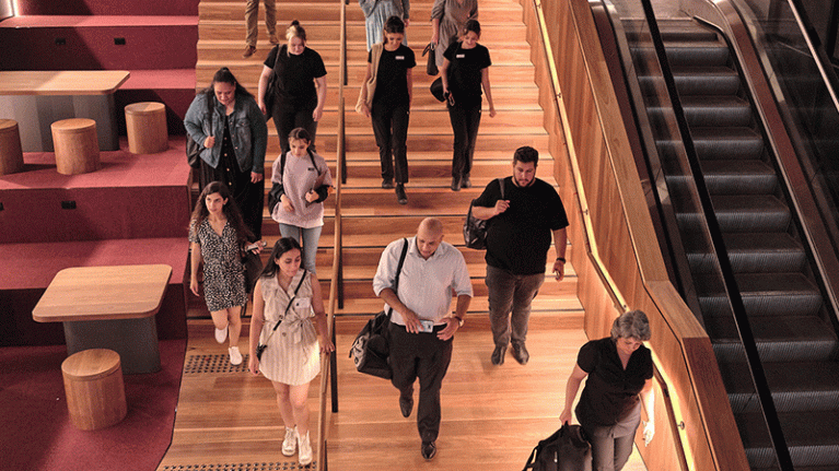 Students walking down the main staircase at City Campus