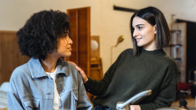  Two female students comforting, dealing with disappointment
