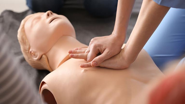  First aid being performed in a learning environment. 