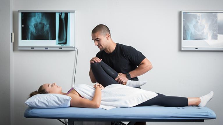  An osteopathy student treating a client in the clinic.