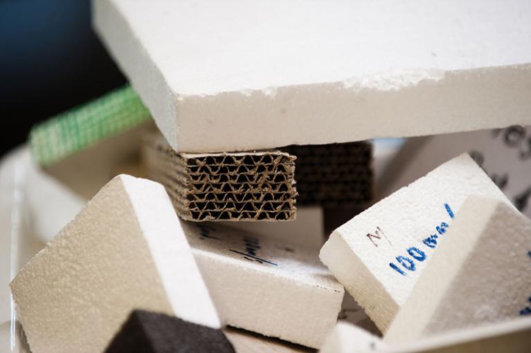 Close up shot of styrofoam and cardboard packaging waste.