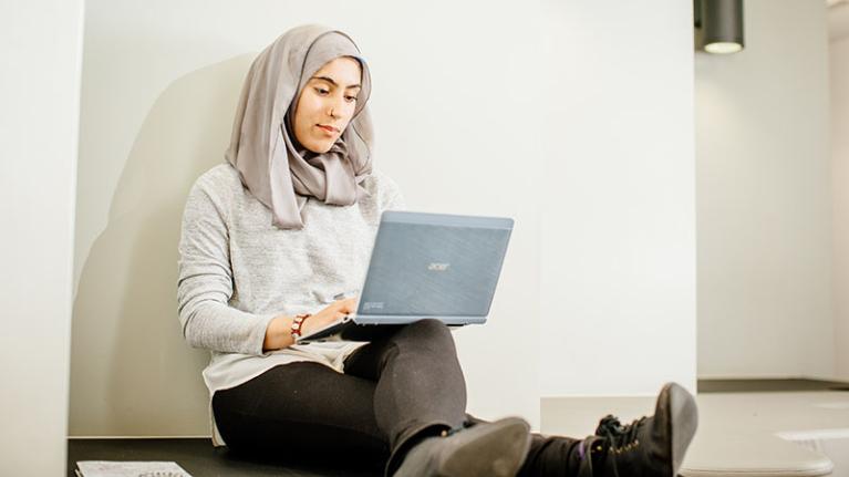 Student working and studying on a laptop