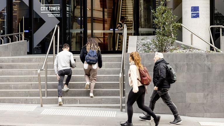  Students walk up the stairs to VU's City Tower.