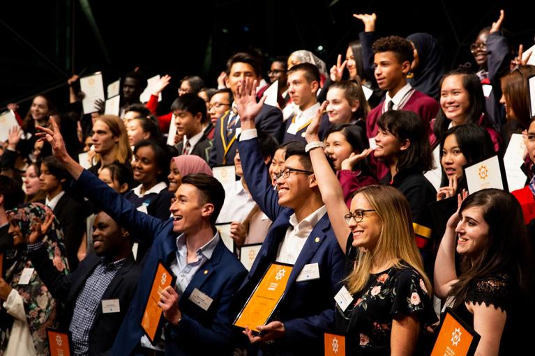 Large group of Western Chances alumni students holding certificates
