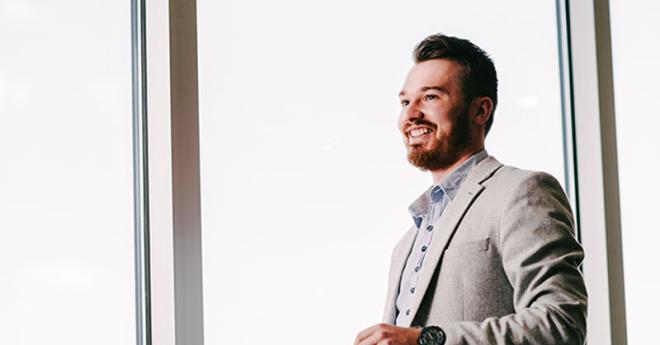   	Clifford Fahler, logistics graduate and CEVA logistics employee, at work in the NBN offices.