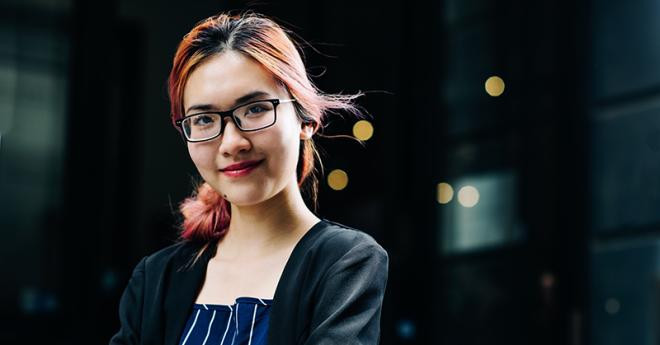 Young woman in professional clothes, outside a business building, Bachelor of Data Science careers