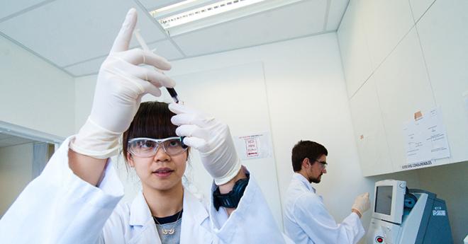  Bachelor of Science students in lab coats