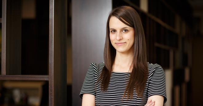 Young woman in professional clothes, in office environment