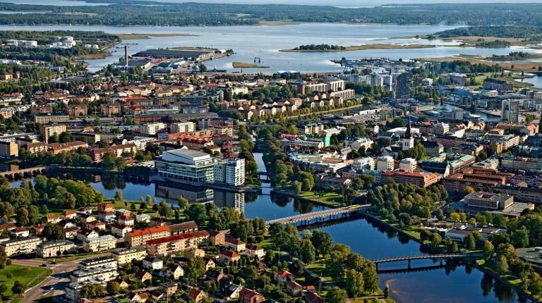  aerial photo of the picturesque town of Karlstad, with a river running through it.