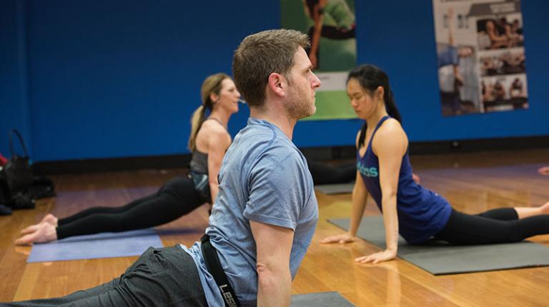 People stretch out in a Body Balance class.
