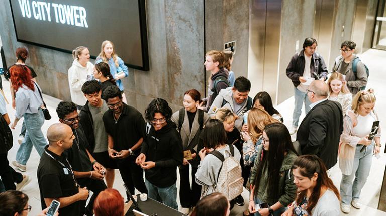  A group of students gathering around the Student Leadership stall at the City Campus O-Fest in 2023.