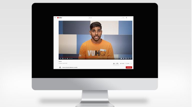 Computer screen with YouTube playing, VUHQ student adviser addressing the camera