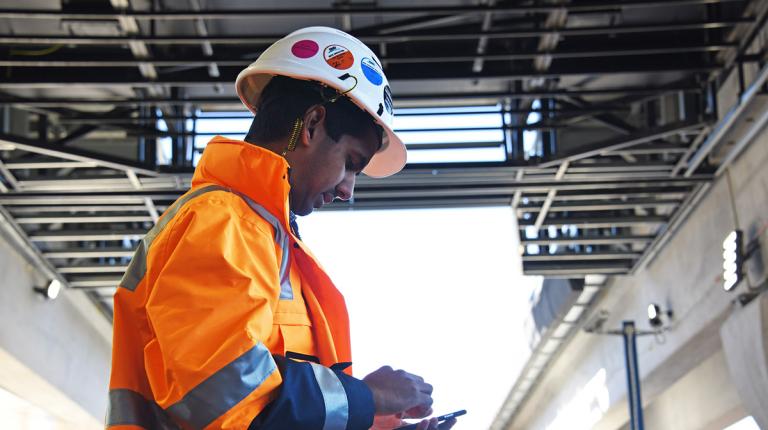  student in protective gear in a warehouse