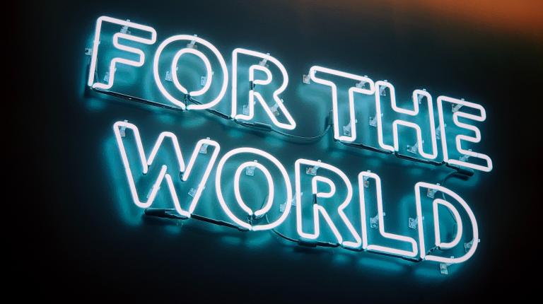  neon sign with the words "for the world"