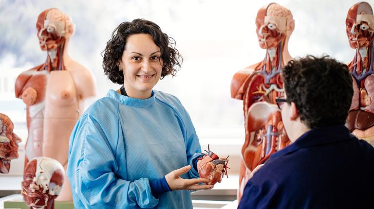  medical student in class studying the organs in the body