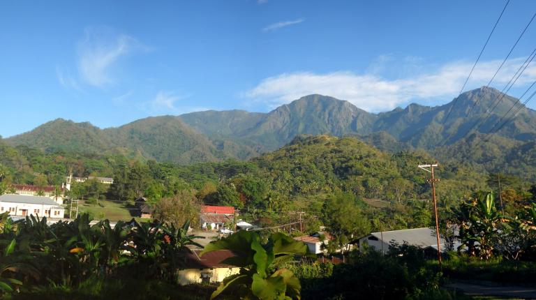 Victoria University has had a long association with Timor Leste. Hills, green landscape and buildings in East Timor