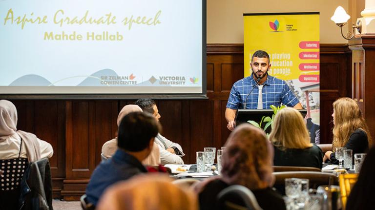 Mahde Hallab making a speech as part of the Aspire program.