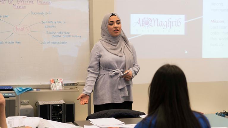 Leader from 2018 SZCC program. Photo of a program participant presenting to a group