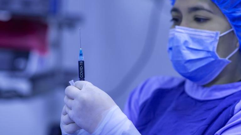  Nurse giving a COVID vaccine