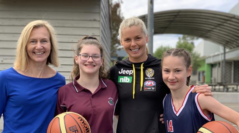 Professor Clare Hanlon, with students from Ringwood Secondary and AFLW star Katie Brennan