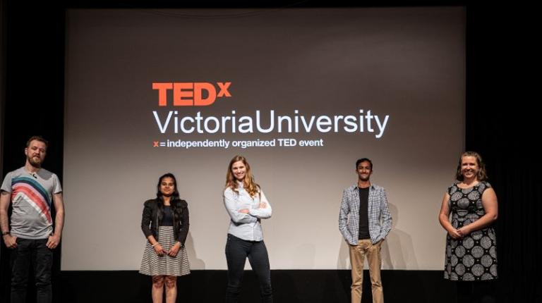 TEDxVictoriaUniversity participants TEDX participants in front of a TEDX Victoria University screen