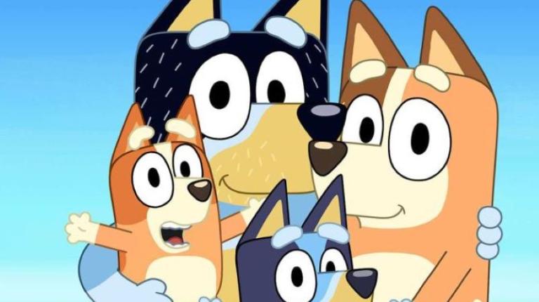 Four colourful cartoon dogs at the beach