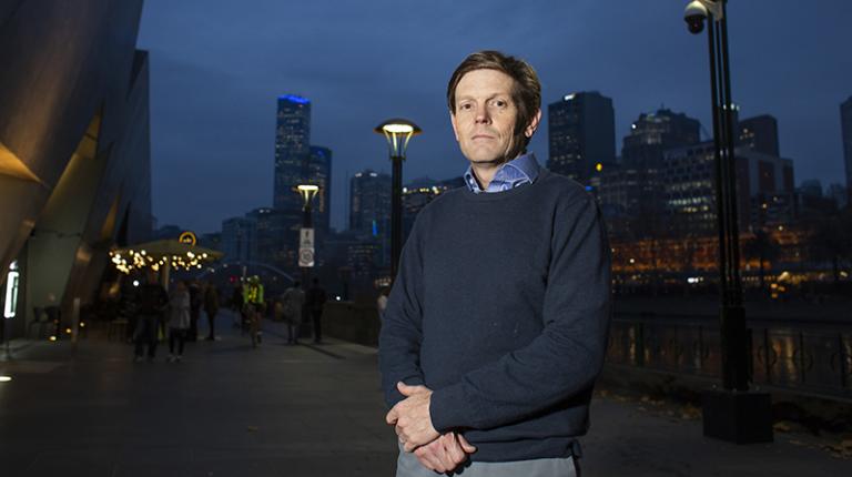 Associate Professor Bruce Mountain Bruce Mountain on a Melbourne street lit by streetlights
