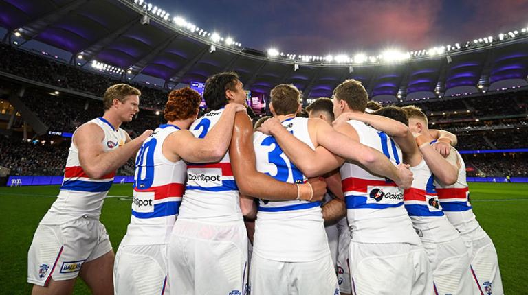 Western Bulldogs players huddle together ahead of their 2022 elimination final against the Fremantle Dockers at Optus Stadium in Perth.