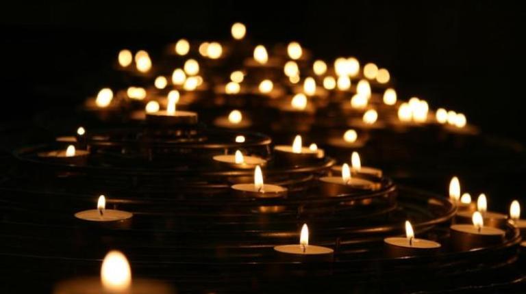 Lots of small candles burning.